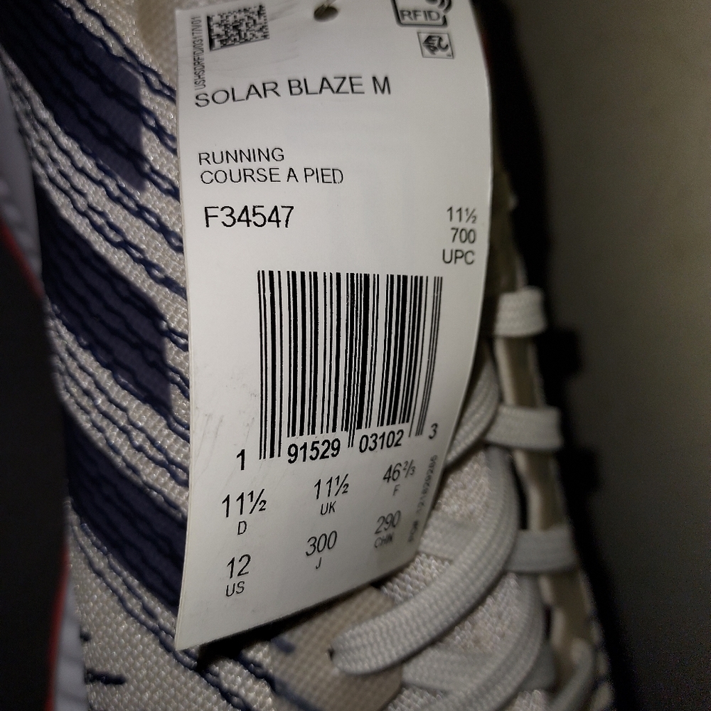 New never worn shoes Adidas, size 12, white blue and orange in color.